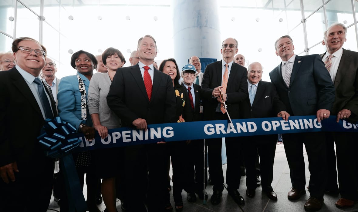 Dr. Kadish cutting ribbon at TCDM grand opening