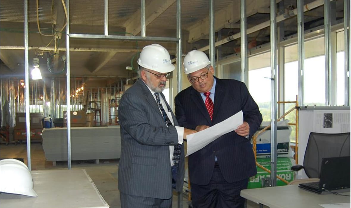 Dr. Jay Goldsmith and Dr. Edward Farkas reviewing plans at building site