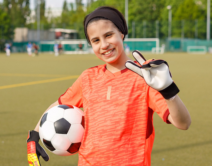 Soccer player smiling on field