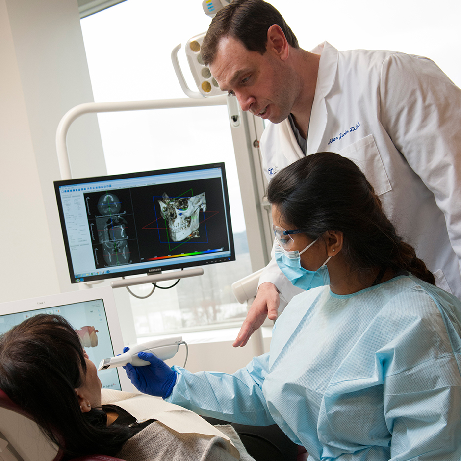 Left to Right: D2 Student Shreya Jha learns digital intraoral scan techniques from Dr. Alan Jurim.
