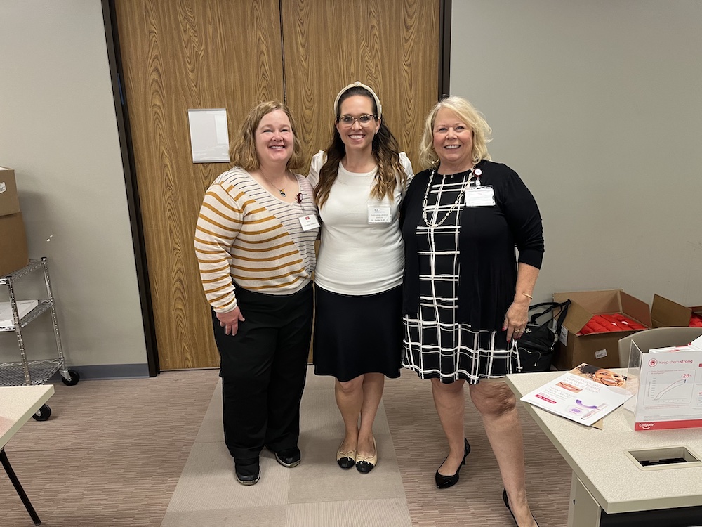 Dr. Erdfarb with Christine Ochsner (left) and Diane Peterson (right), Professional Education Managers, Colgate.