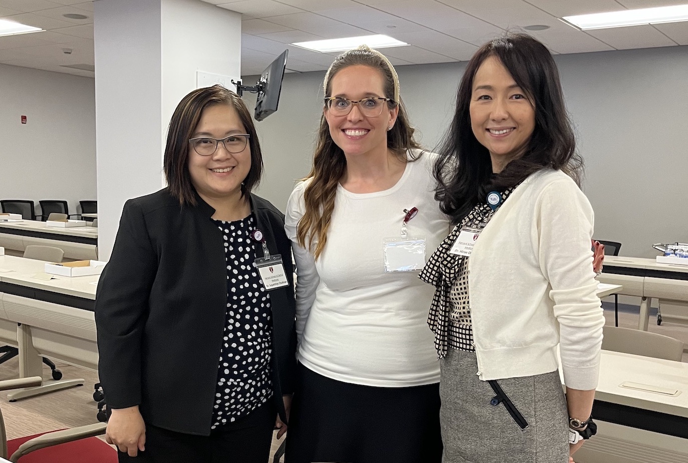 Three female dental educators pose: Dr. Supattriay Chutinan from  Harvard School of Dental Medicine, Dr. Erdfarb from Touro College of Dental Medicine, and Dr. Hiroe Ohyama from Harvard School of Dental Medicine.