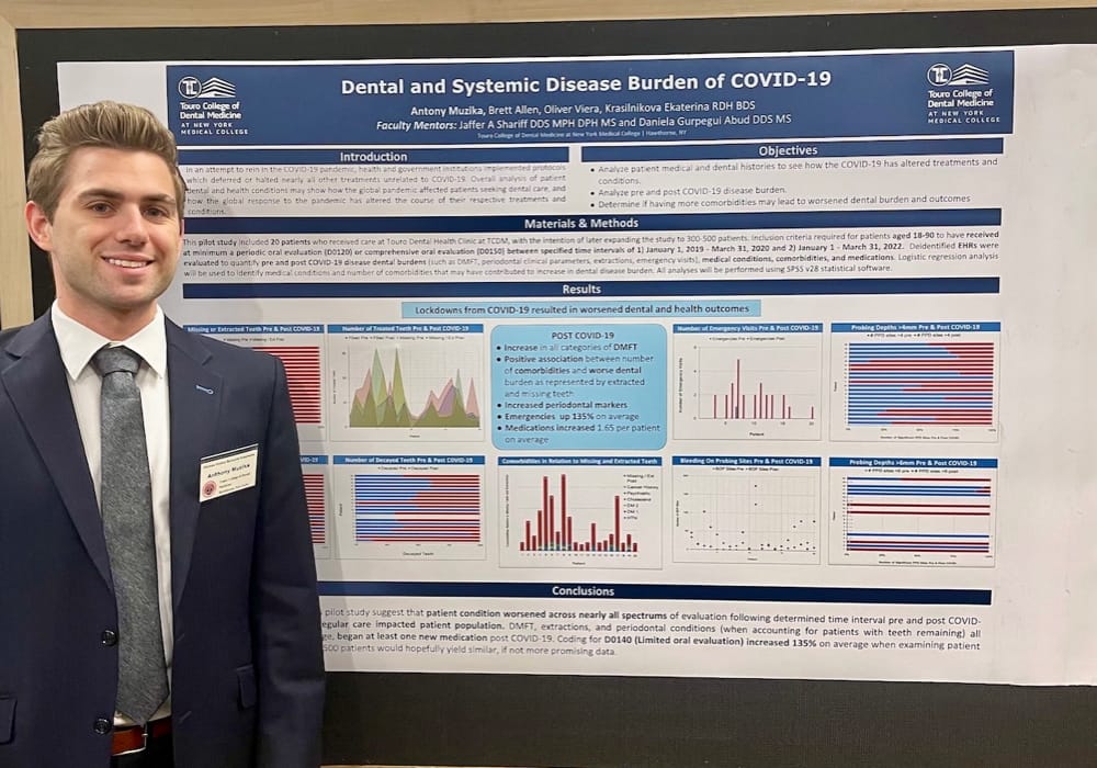 Antony Muzika in front of his research poster on “Dental and Systemic Disease Burden of COVID-19: A Retrospective Study and Recommendations on How to Handle Responses More Effectively to Healthcare Crises and Future Barriers to Care.”