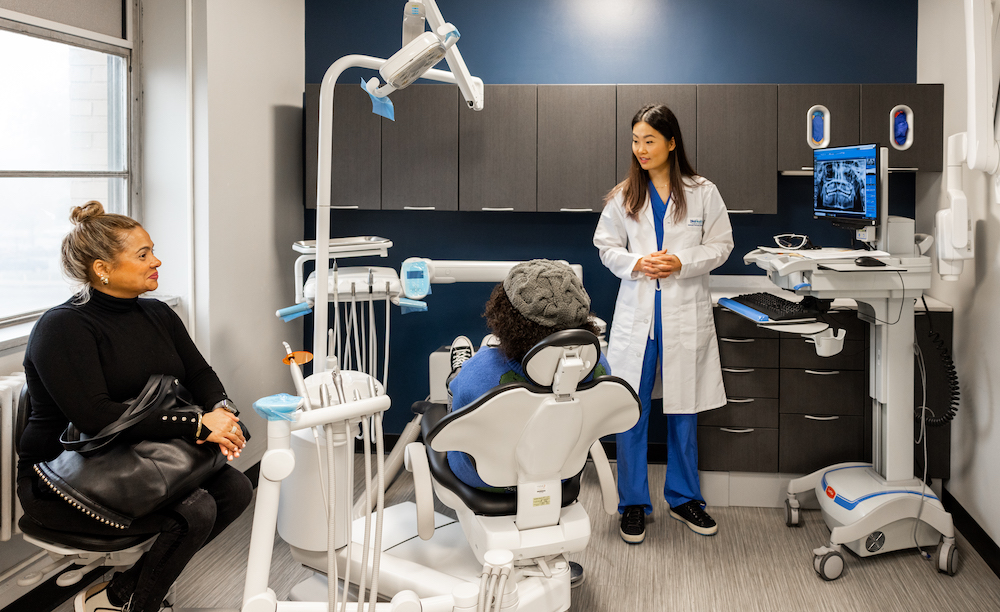 Jessica Li in dental office with patient in chair