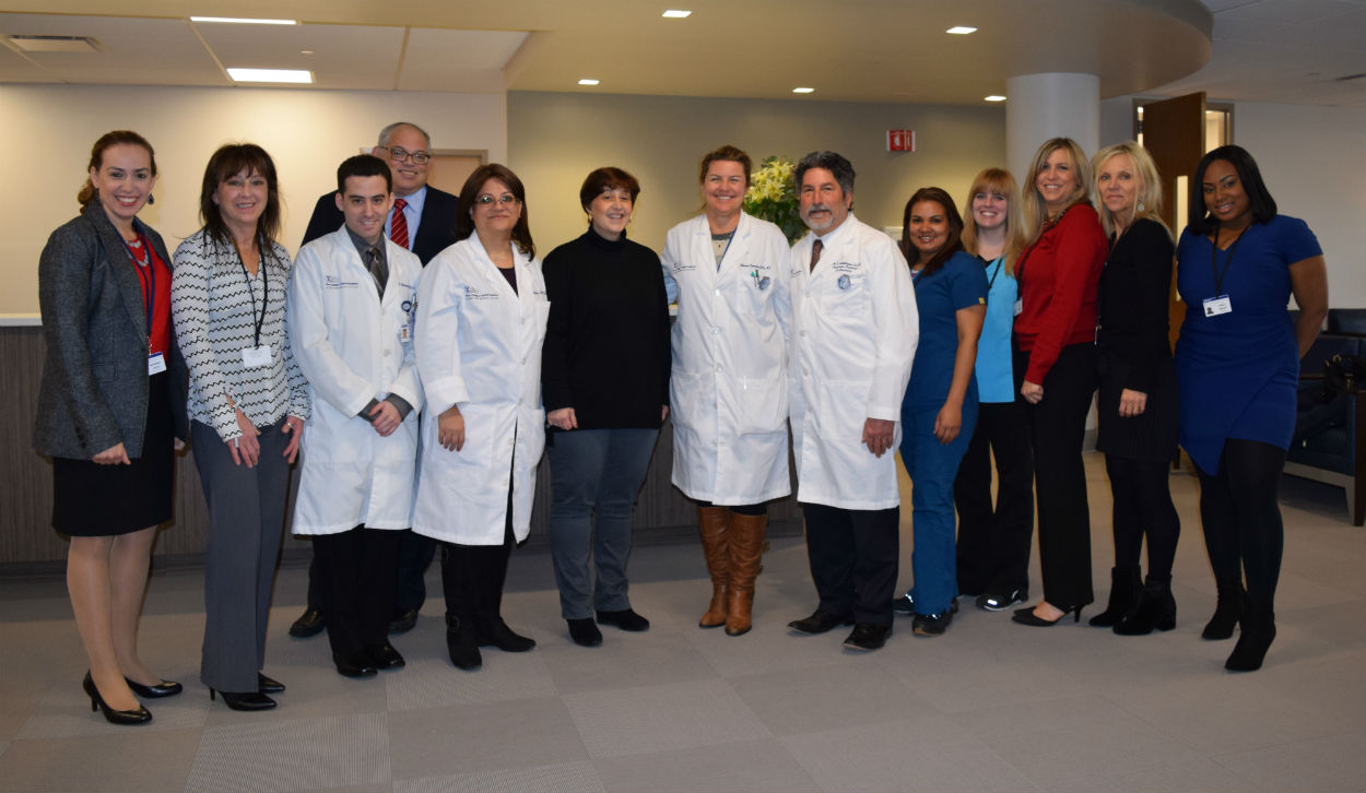 Michelle Rodriguez, fifth from left, with Touro Dental Health faculty, staff and administrators